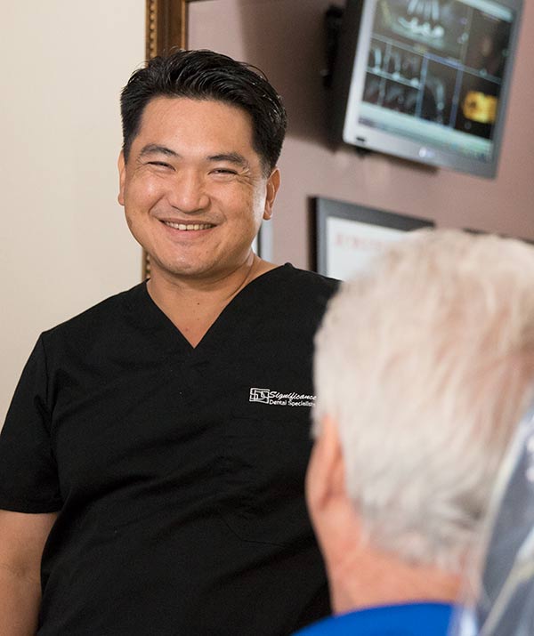 Dr Huang smiles at patient - Las Vegas, NV