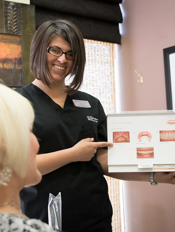 Significance Dental Assistant shows dental illustrations - Las Vegas, NV